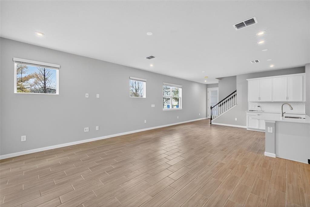 3350 Timber Xing Avenue Brandon, FL 33511 - Photo 14 of 35 a view of an empty room with wooden floor and a window