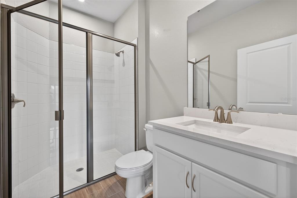 3350 Timber Xing Avenue Brandon, FL 33511 - Photo 16 of 35 a bathroom with a sink toilet and shower