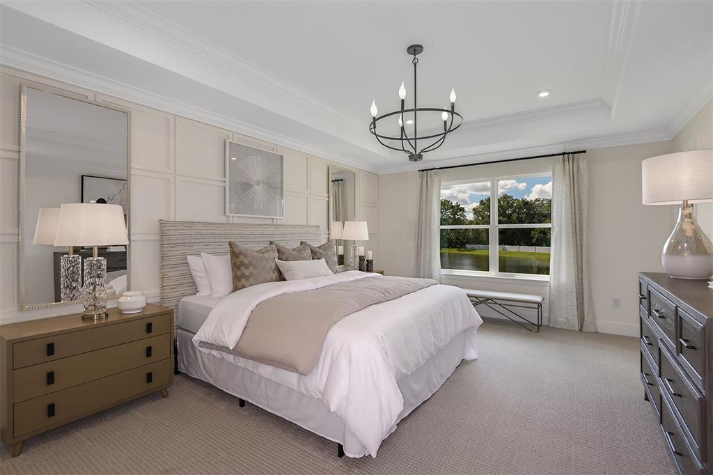 3350 Timber Xing Avenue Brandon, FL 33511 - Photo 10 of 21 a spacious bedroom with a bed chandelier and window