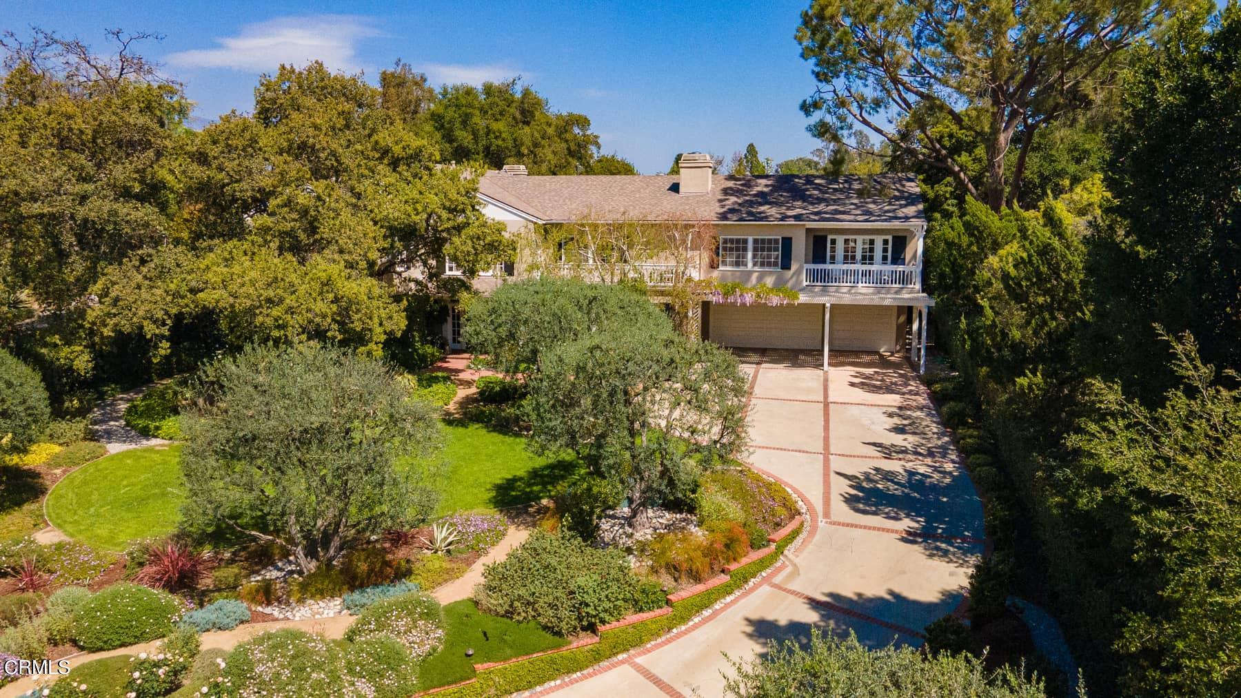 a aerial view of a house with a yard