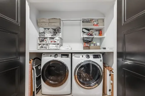 a utility room with dryer and washer