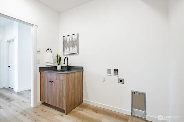 a living room with furniture a fireplace and a large window
