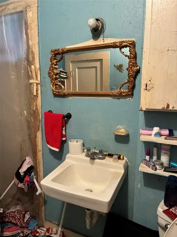 a bathroom with a bathtub and shower