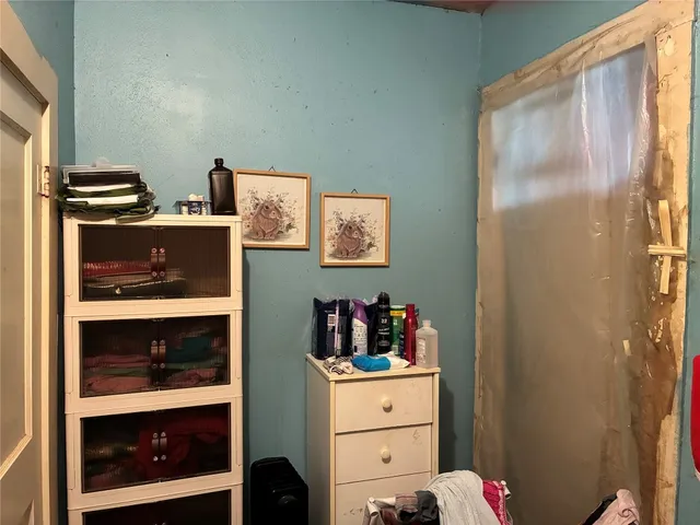 a bathroom with a sink a stove and a mirror