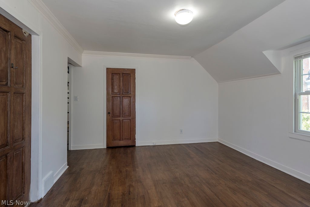 2547 Warwick Road Cleveland, OH 44120 - Photo 27 of 46 Additional living space featuring dark hardwood / wood-style floors, a wealth of natural light, and vaulted ceiling