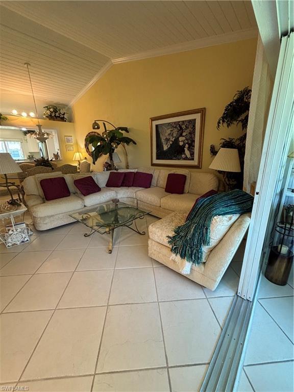 Undisclosed Address Naples, FL 34112 - Photo 13 of 35 Tiled living room with ornamental molding and wood ceiling