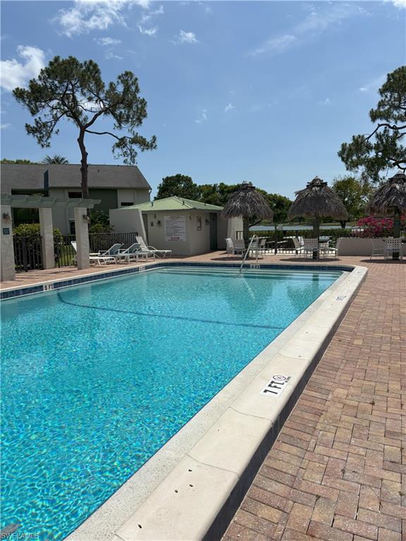 Undisclosed Address Naples, FL 34112 - Photo 31 of 35 Community pool featuring a gazebo and fence
