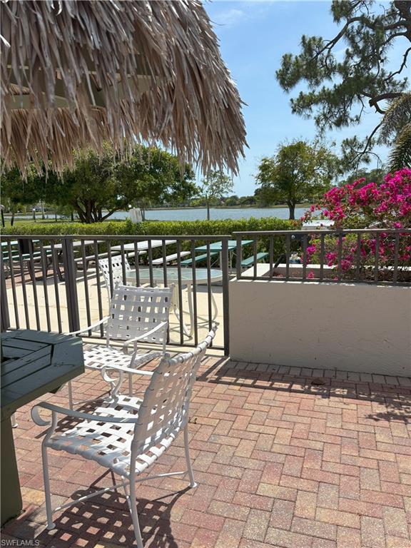 Undisclosed Address Naples, FL 34112 - Photo 34 of 35 View of patio / terrace with a water view