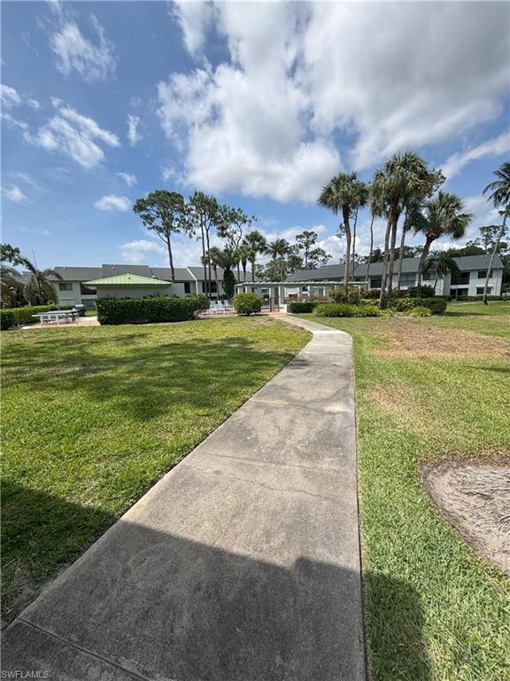 Undisclosed Address Naples, FL 34112 - Photo 35 of 35 View of community with a yard