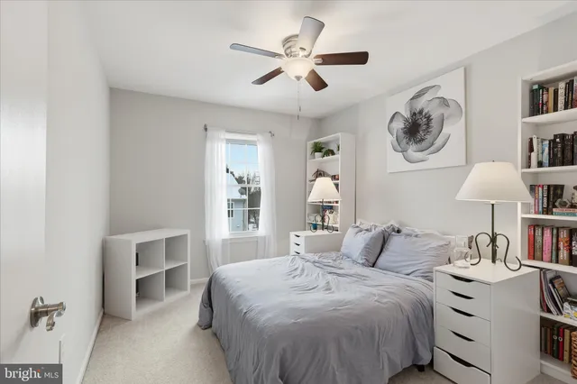 a bedroom with a bed and a table in it