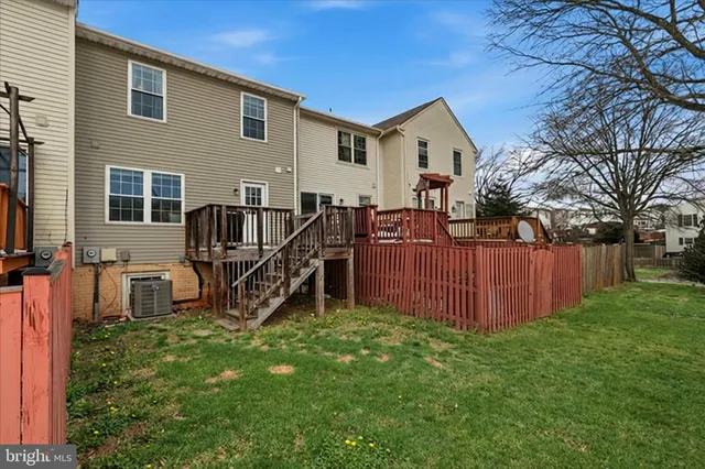 a front view of a house with yard and sitting area