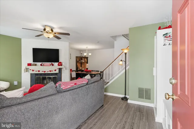 a bedroom with furniture and a flat screen tv