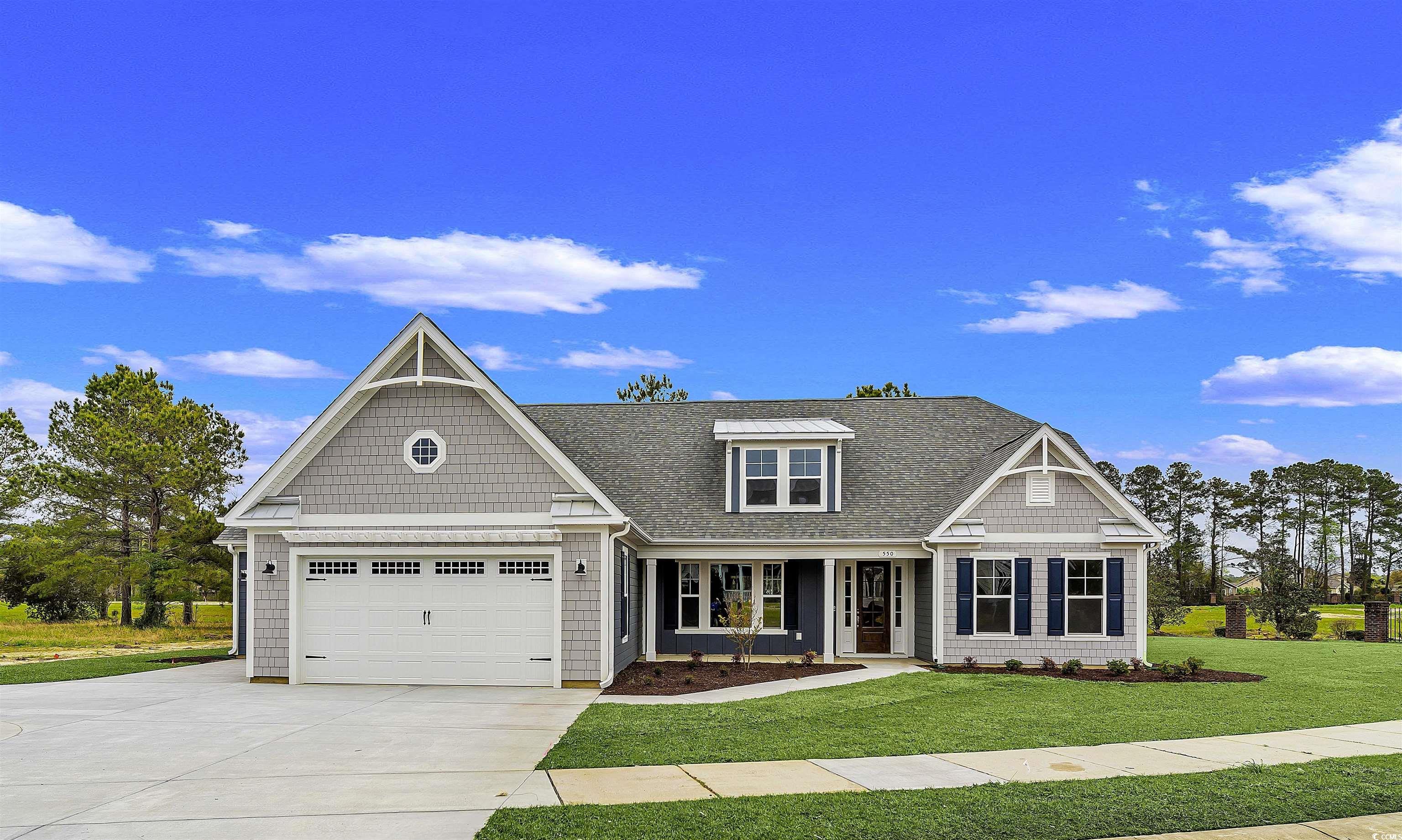 550 Beachside Circle Calabash, NC 28467 - Photo 1 of 39 Craftsman-style home featuring a front lawn, a porch, and a garage
