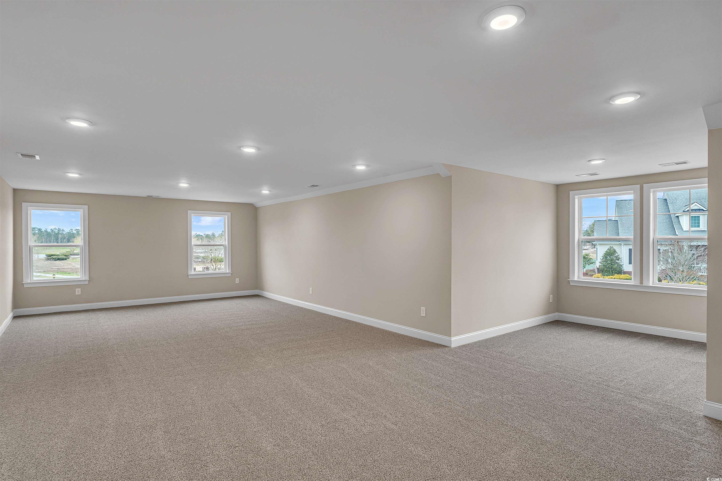 550 Beachside Circle Calabash, NC 28467 - Photo 34 of 39 Carpeted spare room featuring crown molding