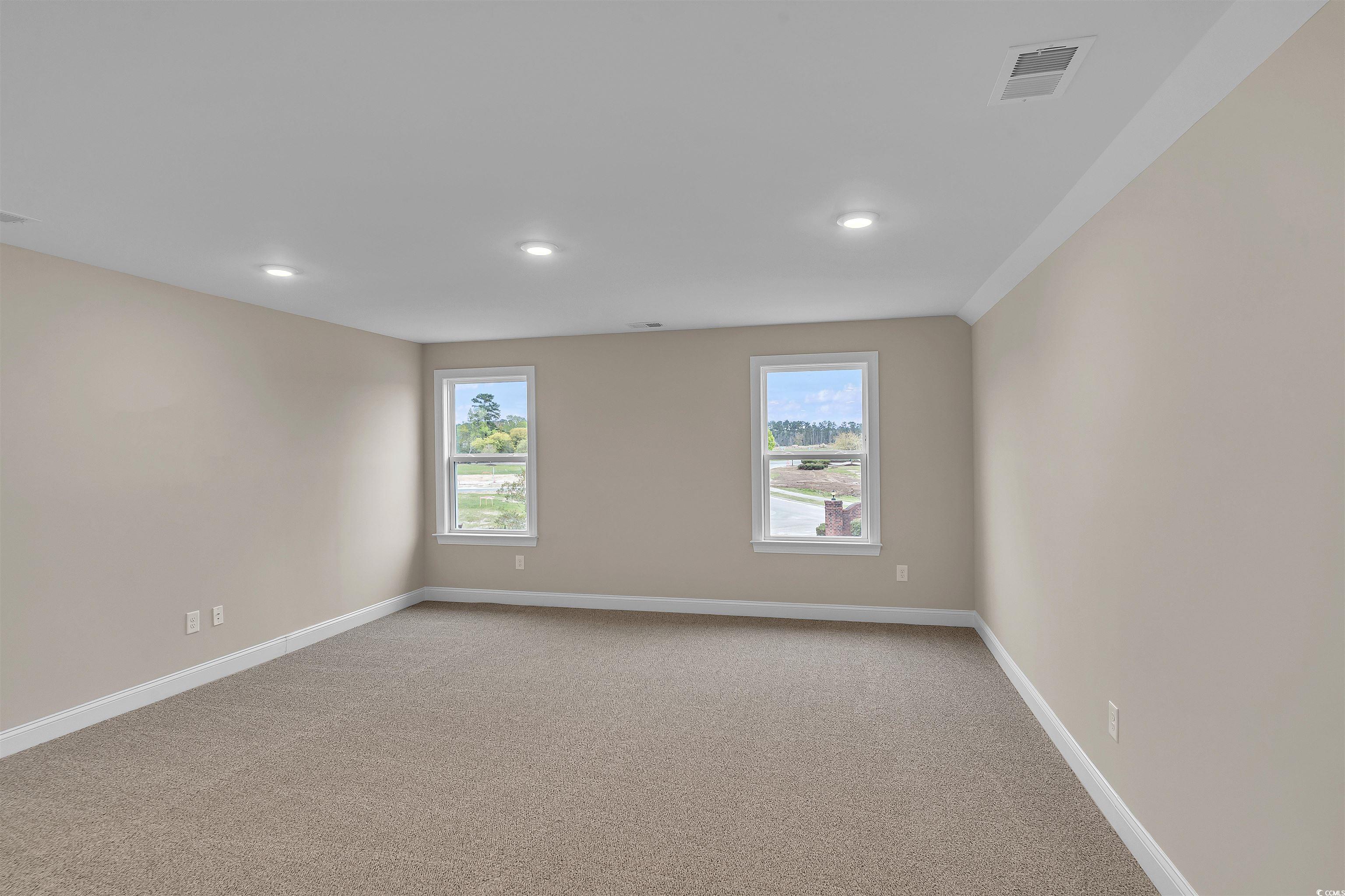 550 Beachside Circle Calabash, NC 28467 - Photo 35 of 39 Carpeted spare room with a healthy amount of sunlight