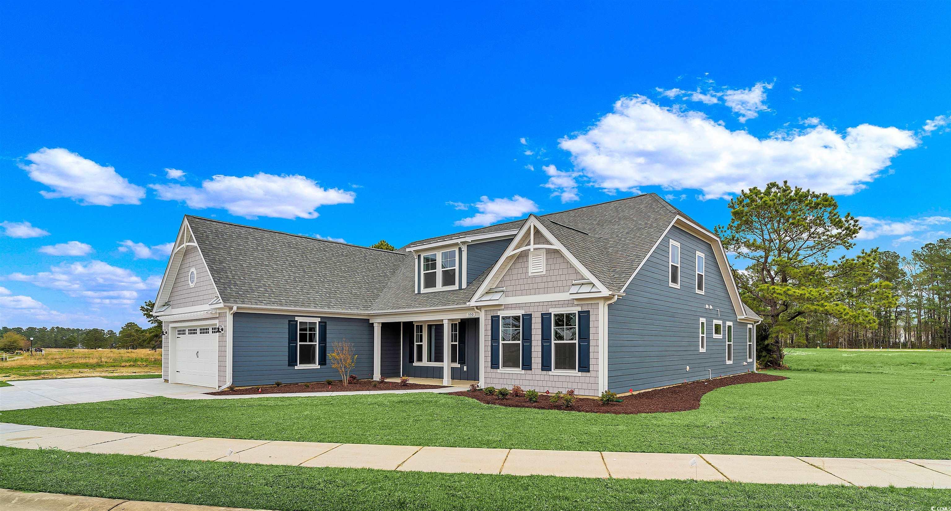 550 Beachside Circle Calabash, NC 28467 - Photo 4 of 39 View of front of home featuring a front lawn and a garage