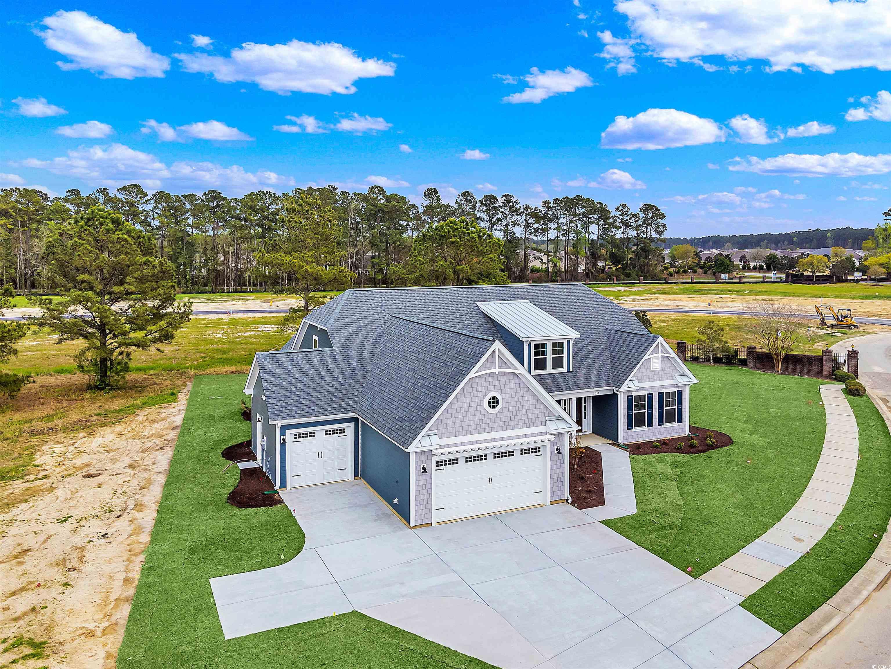 550 Beachside Circle Calabash, NC 28467 - Photo 6 of 39 View of front of property with a garage and a front lawn