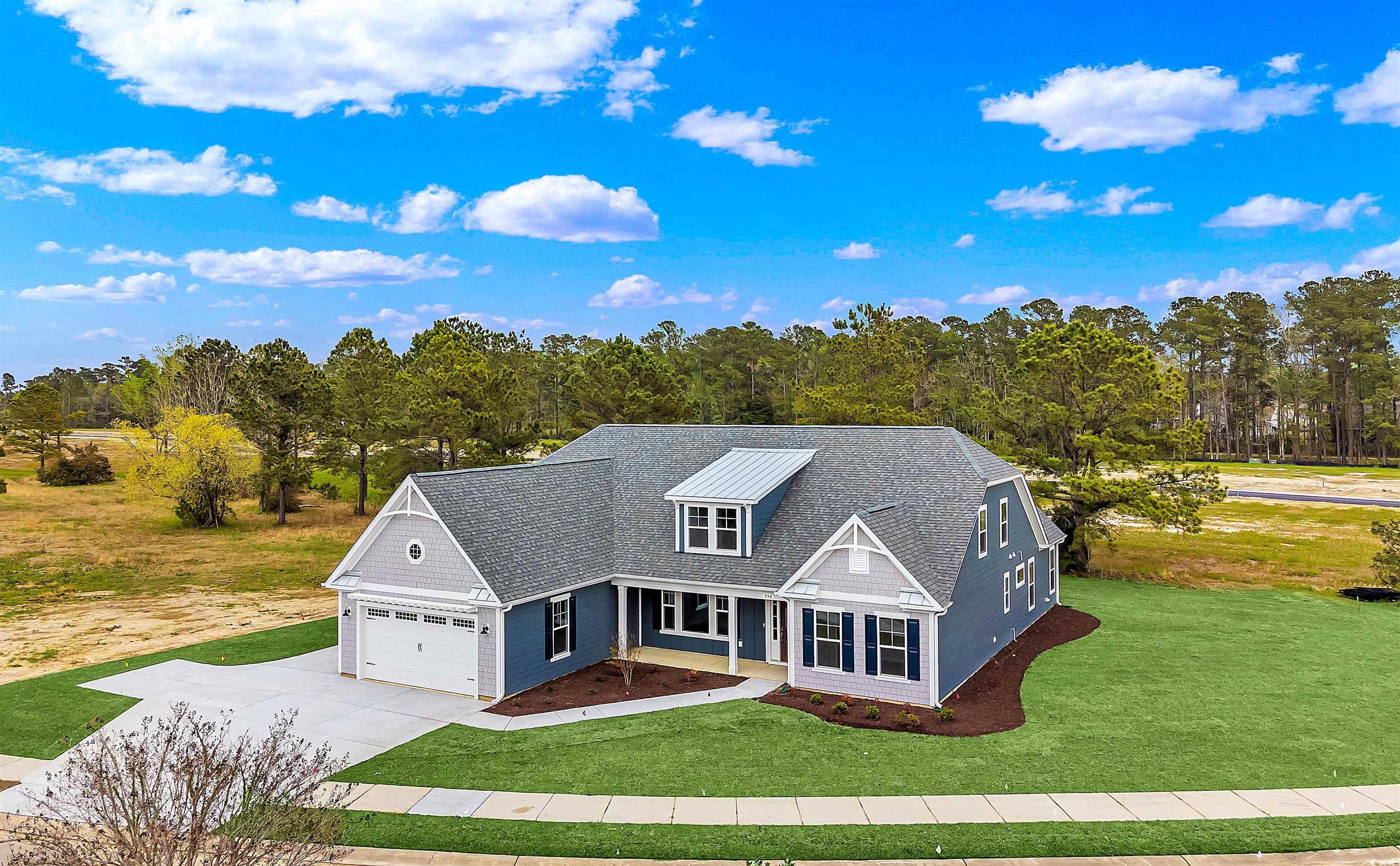 550 Beachside Circle Calabash, NC 28467 - Photo 7 of 39 View of front of property with a garage and a front lawn