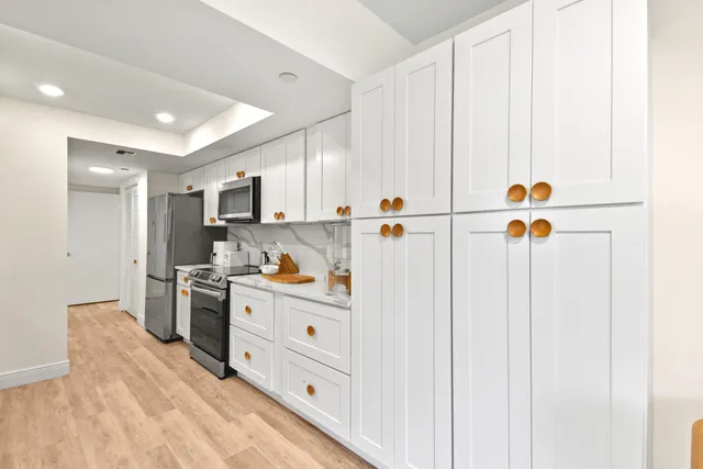 a bathroom with a toilet a sink and a mirror