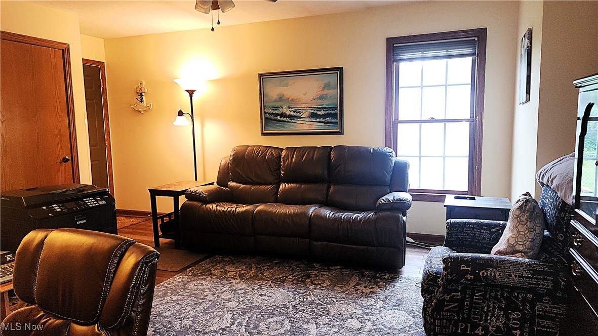 8329 Seasons Road Streetsboro, OH 44241 - Photo 25 of 35 Living room with ceiling fan and hardwood / wood-style flooring