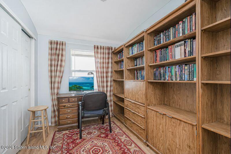 225 Colony Avenue Staten Island, NY 10306 - Photo 12 of 20 a livingroom with a bookshelf