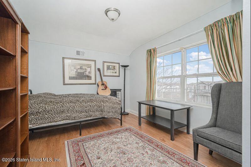 225 Colony Avenue Staten Island, NY 10306 - Photo 13 of 20 a living room with furniture and a window