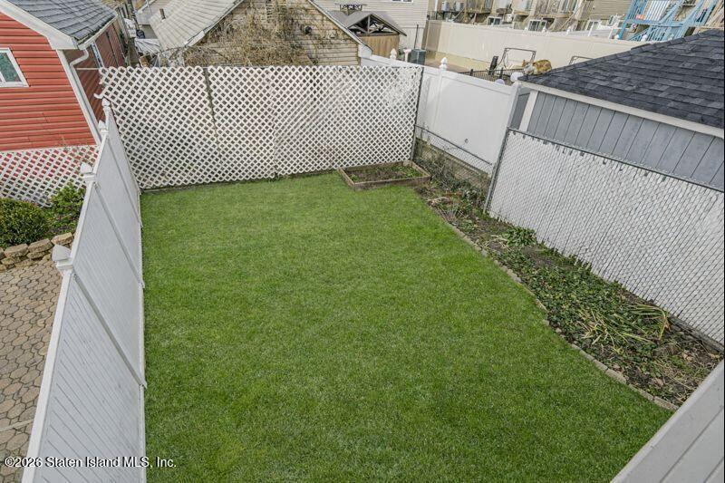 225 Colony Avenue Staten Island, NY 10306 - Photo 16 of 20 a view of a backyard