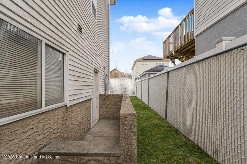 225 Colony Avenue Staten Island, NY 10306 - Photo 17 of 20 a view of a back yard of the house