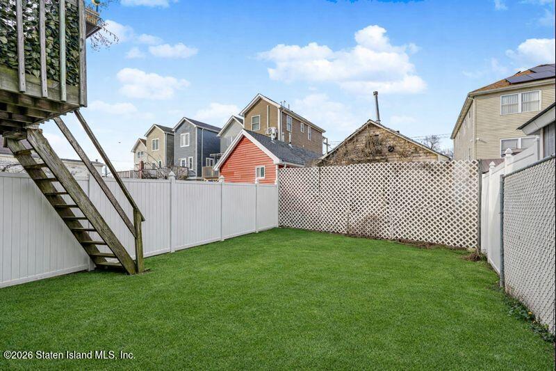 225 Colony Avenue Staten Island, NY 10306 - Photo 20 of 20 a view of a front of a house with a yard