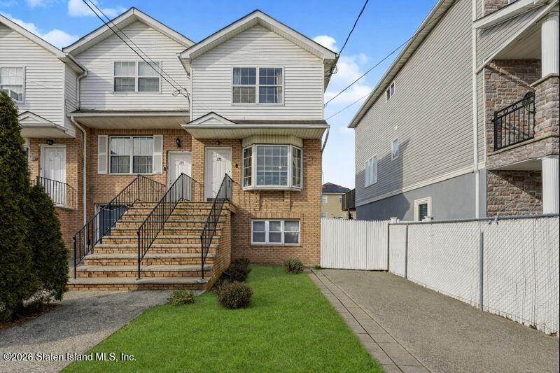 225 Colony Avenue Staten Island, NY 10306 - Photo 2 of 20 a front view of a house with a yard
