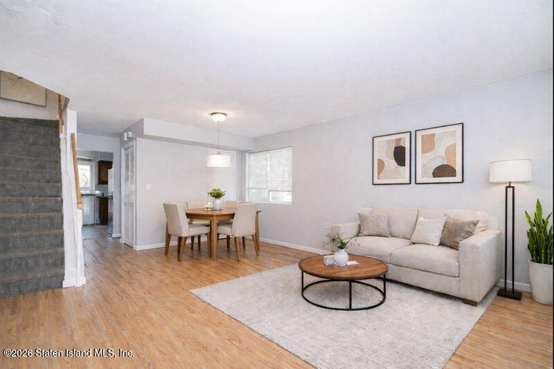 225 Colony Avenue Staten Island, NY 10306 - Photo 3 of 20 a living room with furniture and a wooden floor