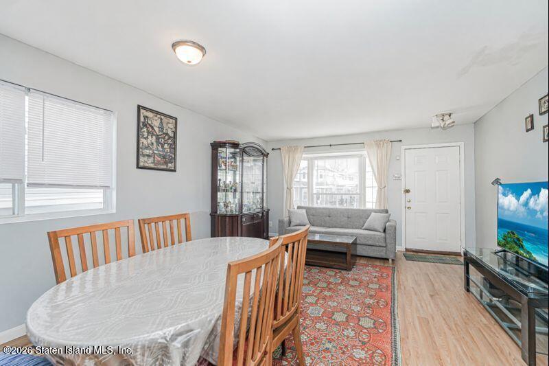225 Colony Avenue Staten Island, NY 10306 - Photo 4 of 20 a living room with furniture and a wooden floor