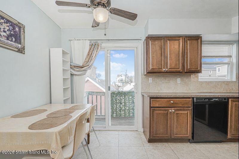 225 Colony Avenue Staten Island, NY 10306 - Photo 5 of 20 a kitchen with stainless steel appliances granite countertop a stove a sink and a refrigerator