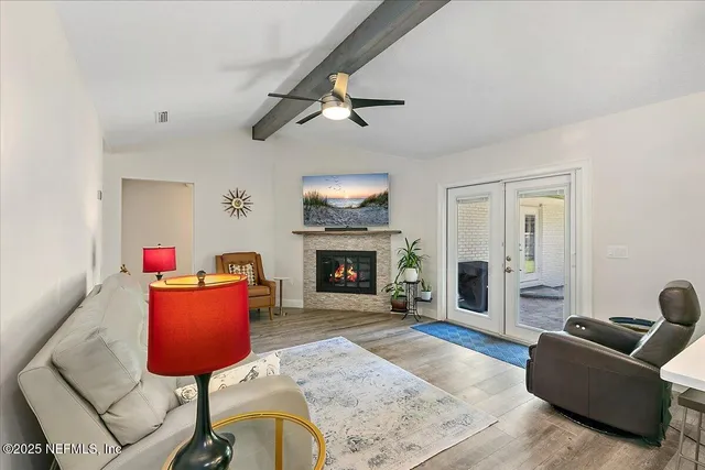 a living room with furniture and a fireplace