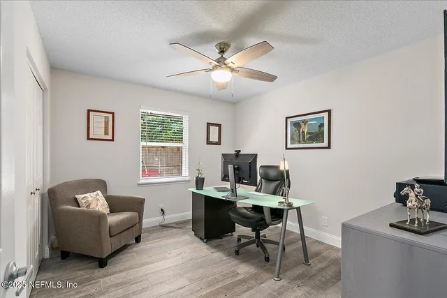 a work room with furniture and windows