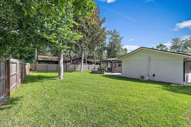 a backyard of a house with entertaining space