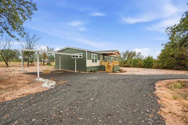 a view of large house with a yard