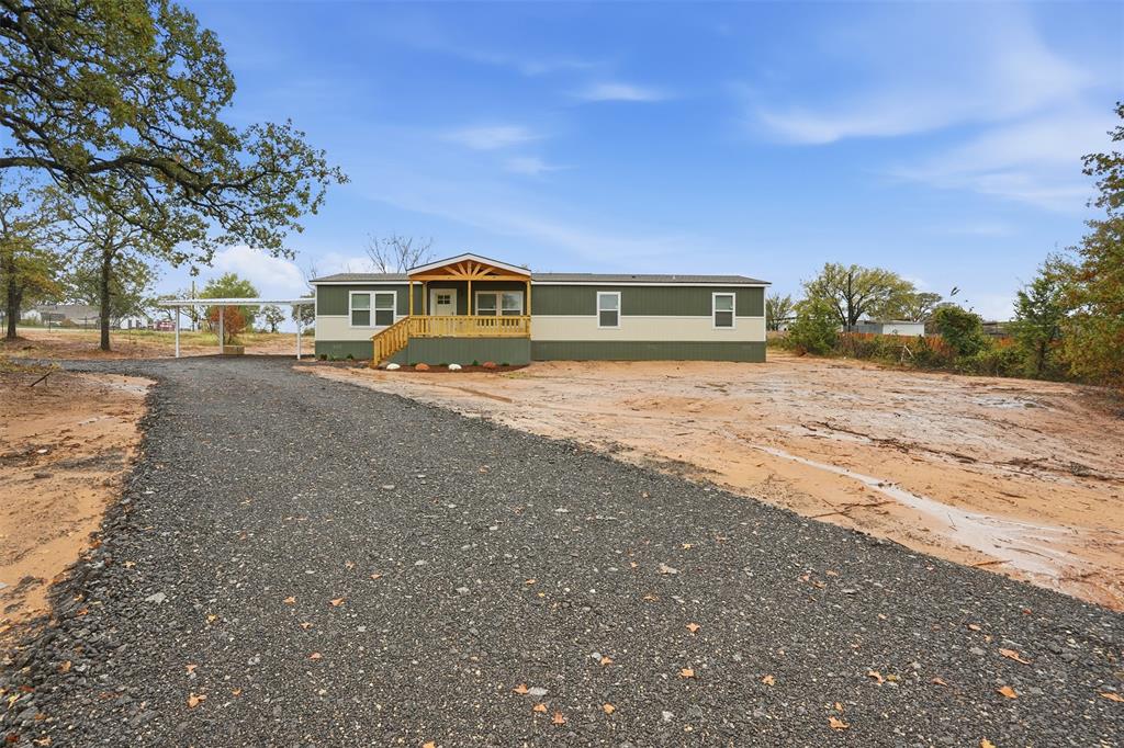 2000 Atticus Court Springtown, TX 76082 - Photo 24 of 25 a view of large house with a yard