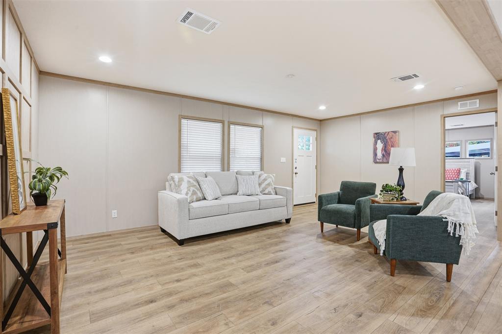 2000 Atticus Court Springtown, TX 76082 - Photo 7 of 25 a living room with couches and a flat screen tv