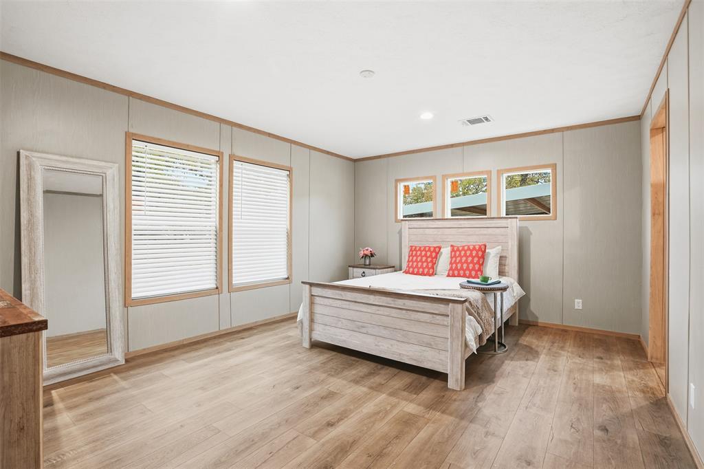 2000 Atticus Court Springtown, TX 76082 - Photo 9 of 25 a bed room with a bed and a window