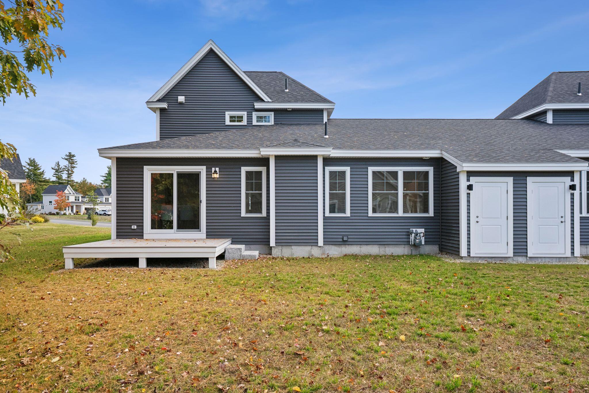 79 Creeks Edge Drive Saco, ME 04072 - Photo 35 of 48 Backyard w/ Rear Deck off Dining Area