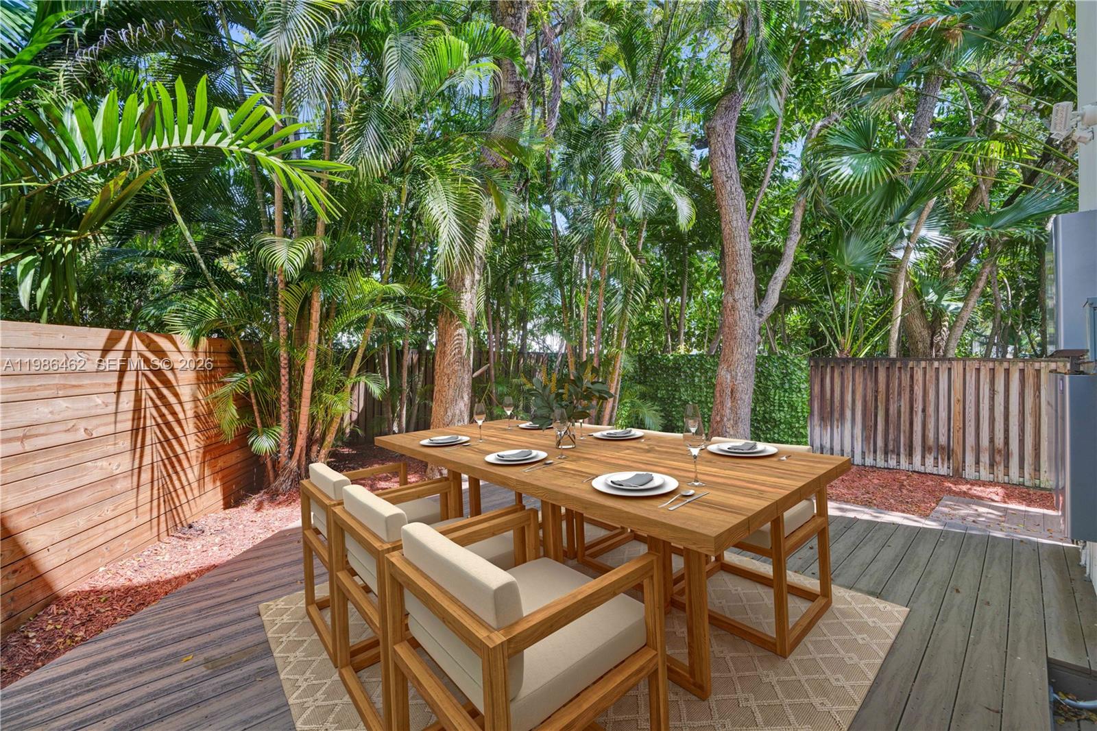 3126 Center Street, Unit 8 Coconut Grove, FL 33133 - Photo 15 of 50 a view of a dinning table and chairs in deck with wooden floor