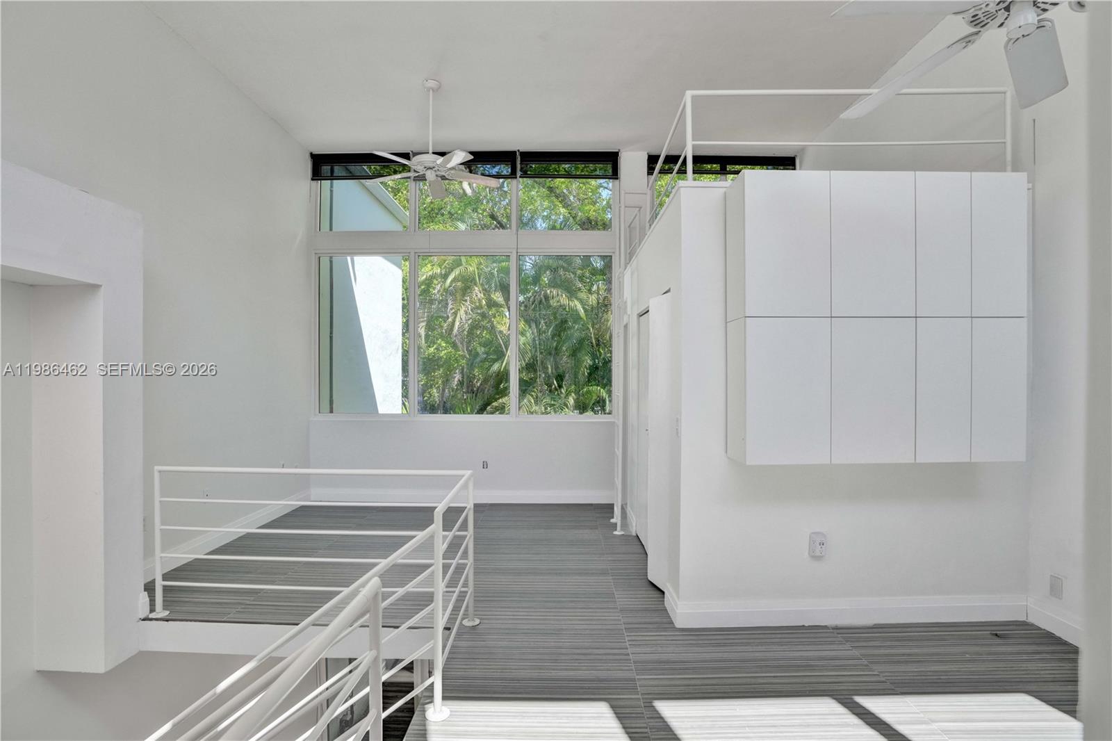 3126 Center Street, Unit 8 Coconut Grove, FL 33133 - Photo 22 of 50 a view of walk in closet with wooden floor