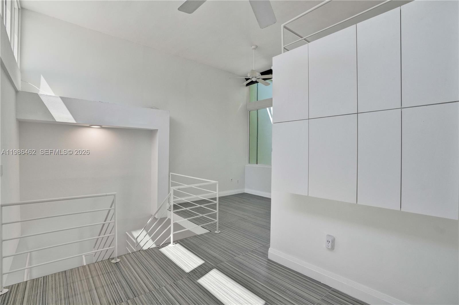 3126 Center Street, Unit 8 Coconut Grove, FL 33133 - Photo 24 of 50 a view of empty room with wooden floor
