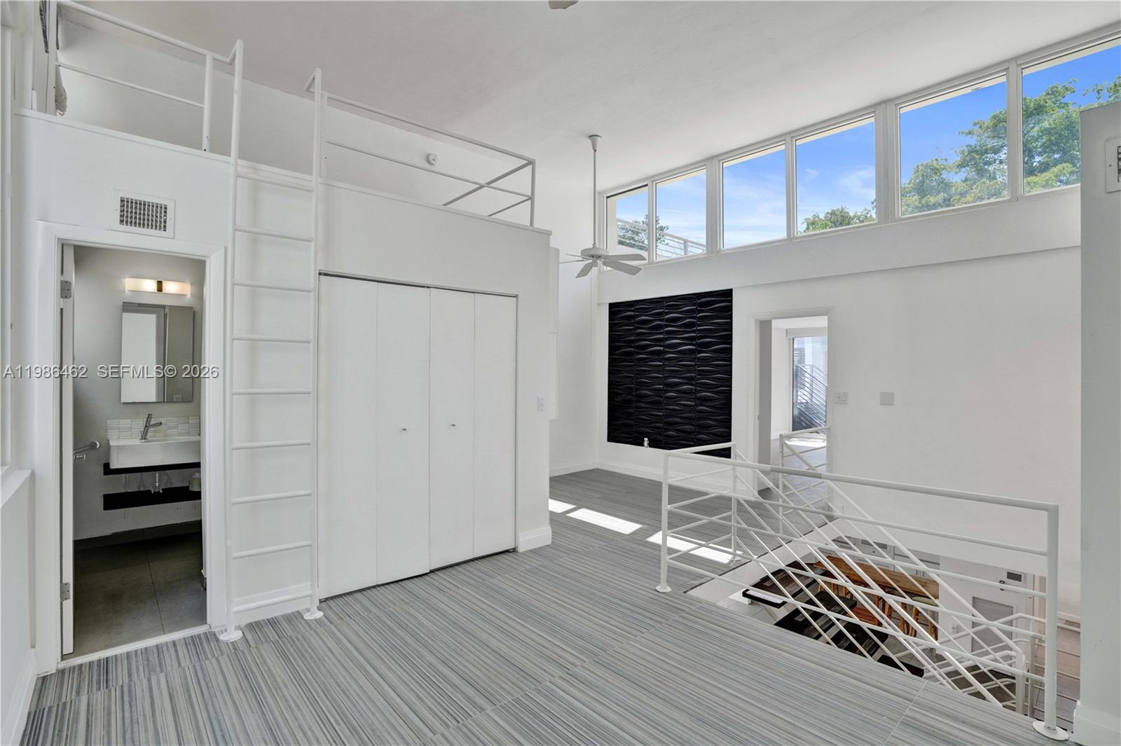 3126 Center Street, Unit 8 Coconut Grove, FL 33133 - Photo 26 of 50 a view of empty room with wooden floor and cabinet