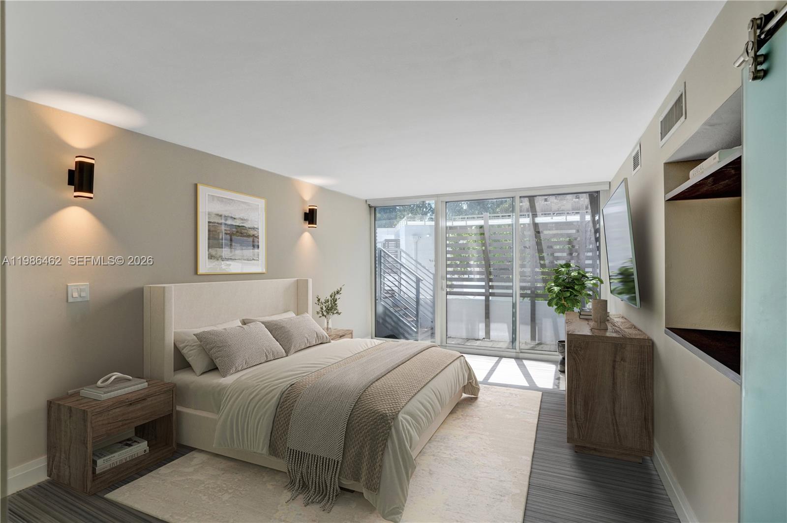 3126 Center Street, Unit 8 Coconut Grove, FL 33133 - Photo 30 of 50 a spacious bedroom with a large bed and a chandelier