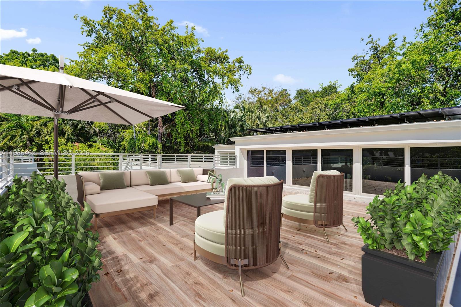 3126 Center Street, Unit 8 Coconut Grove, FL 33133 - Photo 39 of 50 a view of a patio with couches chairs potted plants and a palm tree