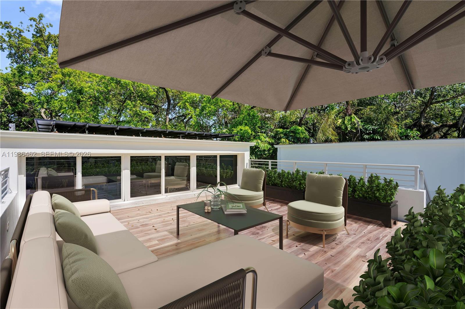 3126 Center Street, Unit 8 Coconut Grove, FL 33133 - Photo 40 of 50 a view of a patio with couches table and chairs under an umbrella