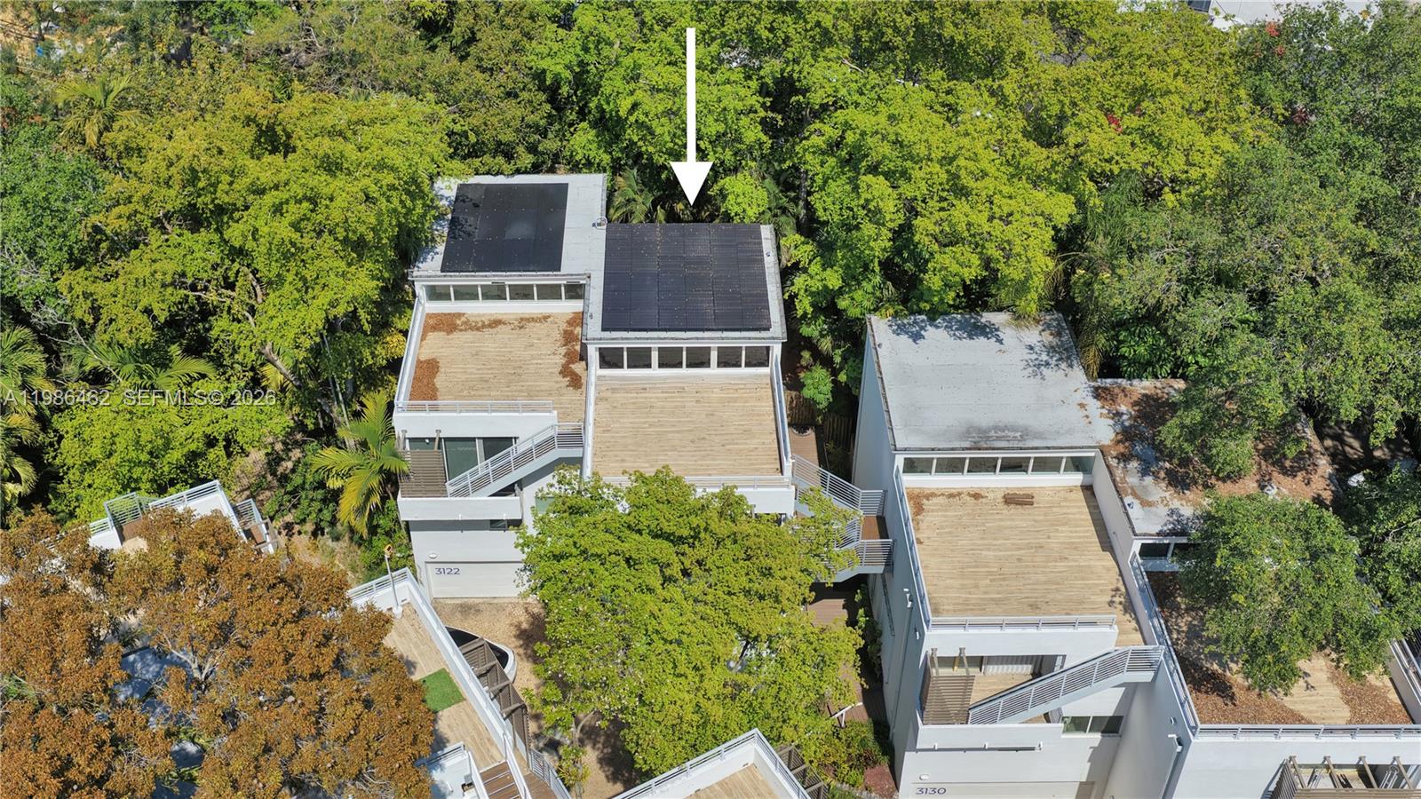 3126 Center Street, Unit 8 Coconut Grove, FL 33133 - Photo 49 of 50 an aerial view of a house with a yard