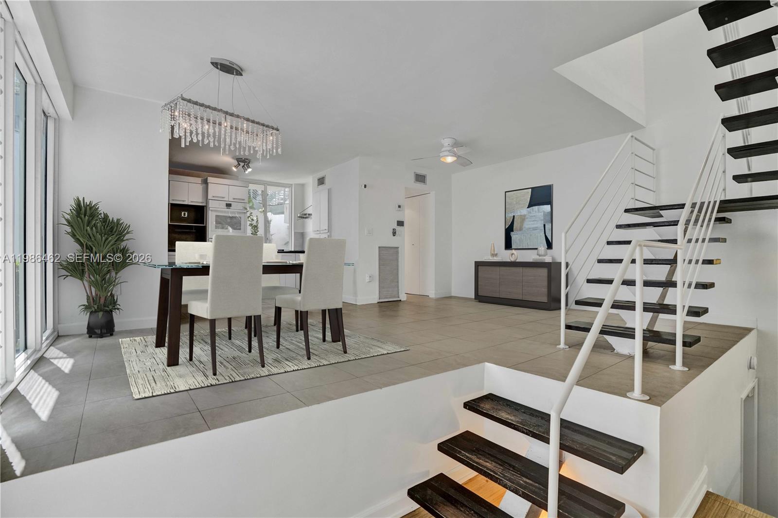3126 Center Street, Unit 8 Coconut Grove, FL 33133 - Photo 5 of 50 a living room with furniture and wooden floor